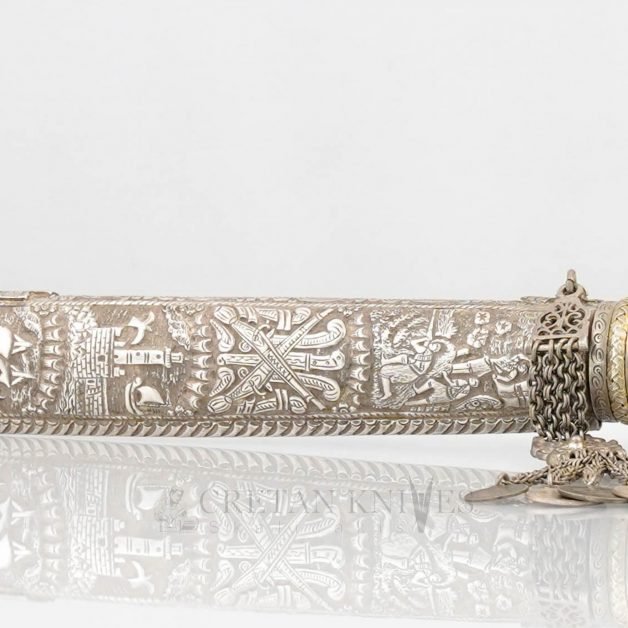 Traditional carved Cretan knife with carved silver case