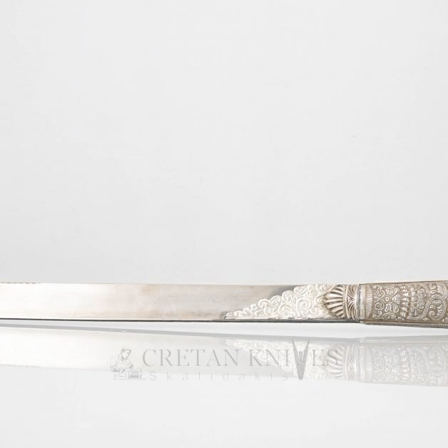 Traditional carved Cretan knife with carved silver case